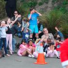 Dunedin's George Street Normal School pupils shield their eyes from dust and debris as the Otago...
