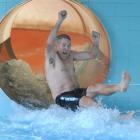 Dunedin's Moana Pool plant supervisor Kevin Brown (63) emerges triumphant from the waterslide...