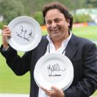 Dunedin's Ronnie Bhogal with two of the plate signatures he has collected. Photo by Peter McIntosh.