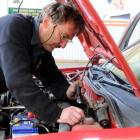 Dunedin Warrant of Fitness Centre inspector Phil Ward  checks a car yesterday. Photo by Craig...