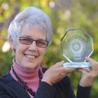 Dunedin woman Genny Hanning shows off the Lions Club International award she accepted in front of...