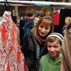 Dunedin woman Rebecca Meikle and her  son Sam browse  through clothing racks at the iD Designer...