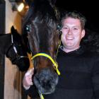 Dylan (Bob) Stratford with Diedre's Flash after his first win as a trainer last night at Forbury...