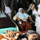 Earthquake survivors receive medical treatment at a hospital in Padang Panjang, West Sumatra,...