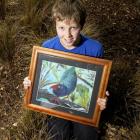 East Taieri School pupil Bailey Clouston with his artwork, Inquisitive Takahe, which won the...