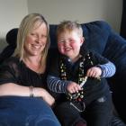 Rebecca Michelle and son Xavier (2), wearing his 'Beads of Courage', relax at home in Mosgiel....