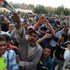 Egyptian protesters shout slogans as they gather to call for the trial of members of ousted...