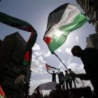 Egyptian university students chant anti-Israel slogans and wave Palestinian flags as they...