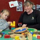 Elle Maultby (3) builds her own kindergarten  with head teacher Paula Reynolds at the Mosgiel...