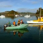 Embarking on a fishing trip from Back Beach in Dunedin yesterday are (from left) Hayden (10),...