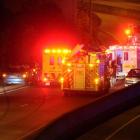 Emergency services tend to the victims of the crash. Photo by Craig Baxter.