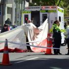 Emergency services work at the scene of a fatal crash in Cumberland St, outside Dunedin Hospital,...