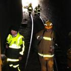 Emergency services workers at the completion of a multi-agency exercise in which a Taieri Gorge...
