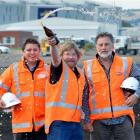 Richard Emerson (c) celebrates work starting at the company's new Anzac Ave site this week, with...