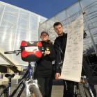 England rugby fans Jodie Burton and Tom Hudson show their "World in Union" scroll outside Otago...