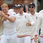 England's Ben Stokes (2nd L) celebrates with teammates after dismissing New Zealand's Kane...