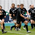 England's Dylan Hartley (C) and his teammates practise at the Stade de France stadium near before...
