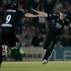 England's Eoin Morgan, right, celebrates with James Anderson after running out Pakistan's Saeed...