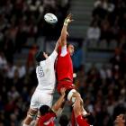 England's James Haskell (L) and Georgia's Dimitri Basilaia contest a lineout. Photo: REUTERS...