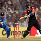 England's Kevin Pietersen plays a shot as India captain MS Dhoni watches during their Twenty20...