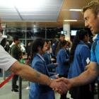 England supporter Adam Morton sen, of Dunedin, shakes hands with England captain Chris Robshaw at...