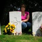 Englishwoman Sally Higgins, who tends the war grave of New Zealand pilot Sergeant Jack Broadley,...