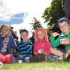 Enjoying eating strawberries and cream at the Waimate Strawberry Fare on Saturday are the Hay...