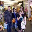 Enjoying some retail therapy in George St, Dunedin, yesterday are (above) Dwayne and Katie Smith,...