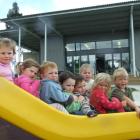 Enjoying the facilities at the newly opened Clutha Valley Playcentre yesterday are (from left)...