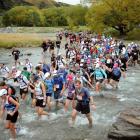 Entrants wade across a river during the 2011 Motatapu event. Photo by Stephen Jaquiery.