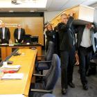 Environment Canterbury's (ECan) councillors carry a coffin out of their final meeting after they...