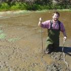 Environment Southland aquatic ecologist Dr Andy Hicks takes samples from a silt pond on a...