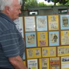 Eric Brockie of Dunedin has been amazed at the interest his display of advertisements from the...