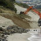 A digger repairs some of the damage on Dunedin’s St Clair beach near Moana Rua Rd after heavy...