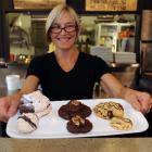 Espresso Garden Cafe manager Shona Miller holds a plate of the cafe's regular and bite-size...