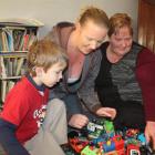 Ethan Murphy-Sakkers plays with his mother, Annika Murphy, and grandmother Debora Murphy.