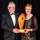 Evan and Kay Moore with the Mike Wolter Memorial Trophy for champion pinot noir, awarded to their...