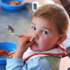 Evie Norton (1) enjoys her lunch at the Koputai early Childhood Centre. Photo by Gerard O'Brien.