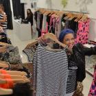 Evolution Clothing area manager Nikki Webster, of Mount Maunganui, prepares the company's new...