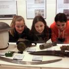 Examining  some of the items on display at the Central Stories museum are (from left) Jessica...