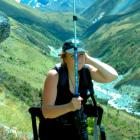 Falcon researcher Dr Donna Falconer (photographed by a motion-activated  camera) uses a walking...