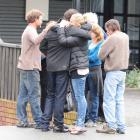 Families comfort each other as they leave a meeting at Pike River Coal on Saturday. Photo by...