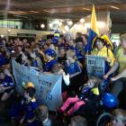 Fans gather at Dunedin Airport to welcome the victorious Otago rugby team and the Ranfurly Shield...