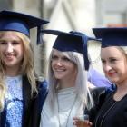 Fashion design graduates (from left) Margot Rieder, Jojo Ross and Tara Young are all smiles after...
