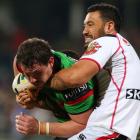 Feleti Mateo of the Warriors tackles Dave Tyrrell of the Rabbitohs. (Photo by Paul Kane/Getty...