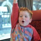 Felix Hayde Cowan, of Dunedin, shows his excitement as the Silver Fern Railcar sets off from the...