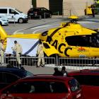 Fernando Alonso is carried to a helicopter after crashing his car during a test session at...