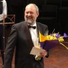 Festival music co-ordinator Aart Brusse receives a long service award for his work. Photo by...