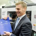 Finance Minister Bill English with the Budget he will present to Parliament today. Photo NZPA.