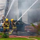 Fire fighters tackle a serious fire at Corporate Consumables, Fisher Crescent, Mount Wellington,...